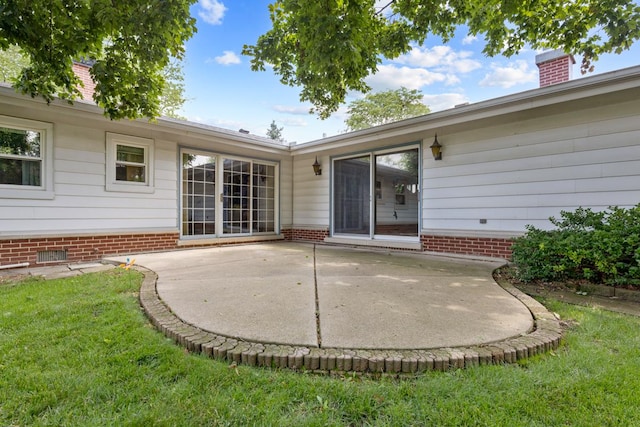 534 Grosvener Ln, Elk Grove Village, IL 60007 - back of property with a patio area, a yard, and a chimney