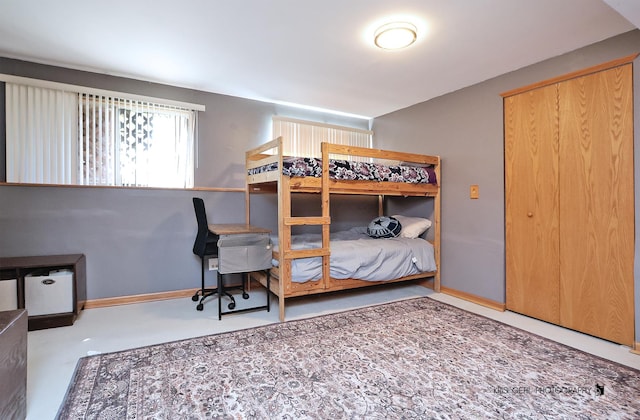 2227 N Quaker Hollow Ln, Round Lake Beach, IL 60073 - bedroom featuring finished concrete floors and baseboards