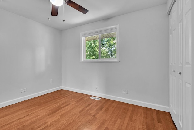 1549 Revere Cir, Schaumburg, IL 60193 - unfurnished bedroom featuring a closet, light wood-style floors, and ceiling fan