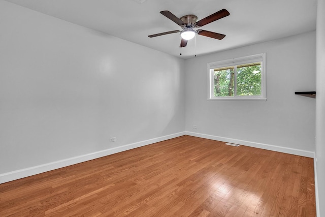 1549 Revere Cir, Schaumburg, IL 60193 - empty room featuring wood finished floors and ceiling fan