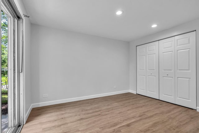 1549 Revere Cir, Schaumburg, IL 60193 - unfurnished bedroom featuring light wood-style flooring and recessed lighting