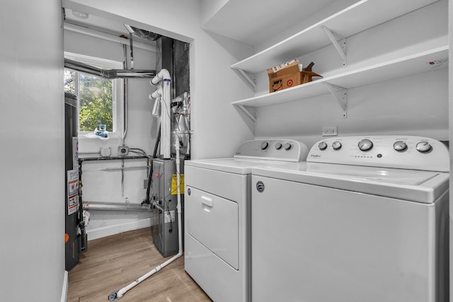 1549 Revere Cir, Schaumburg, IL 60193 - laundry room featuring separate washer and dryer and light wood-style floors