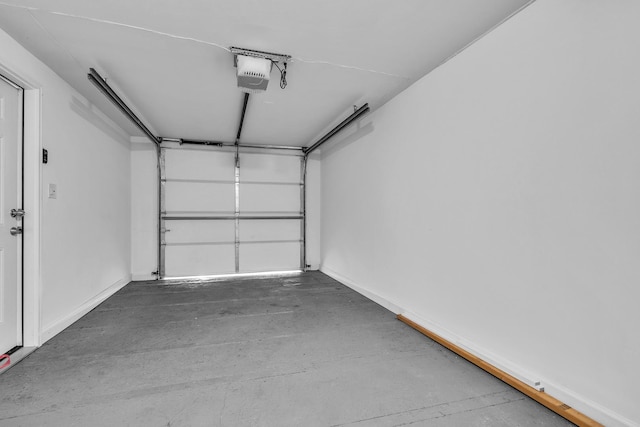 1549 Revere Cir, Schaumburg, IL 60193 - garage with a garage door opener and baseboards