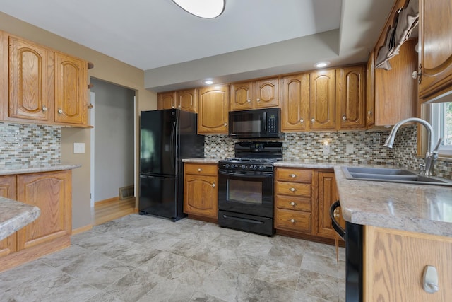 215 S Park Blvd, Streamwood, IL 60107 - kitchen with black appliances, tasteful backsplash, and brown cabinets