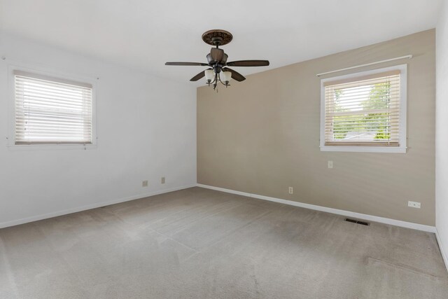 215 S Park Blvd, Streamwood, IL 60107 - spare room with light colored carpet and ceiling fan