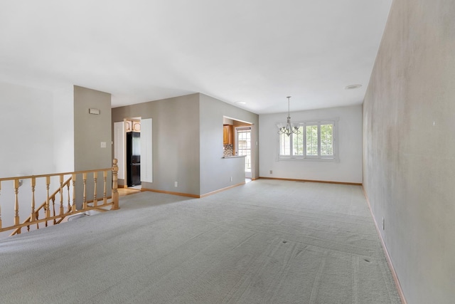 215 S Park Blvd, Streamwood, IL 60107 - spare room with a chandelier and light carpet