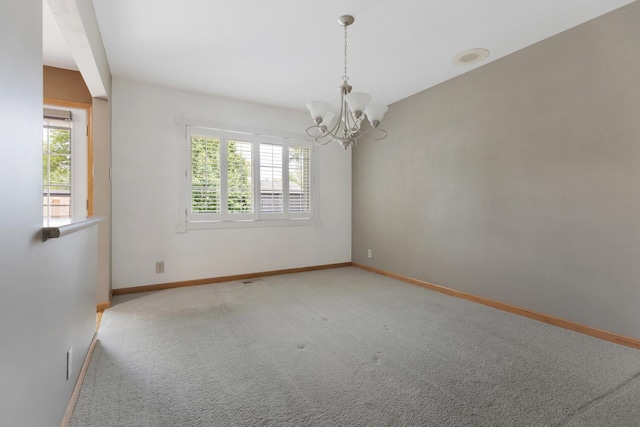 215 S Park Blvd, Streamwood, IL 60107 - empty room featuring plenty of natural light, a chandelier, and carpet