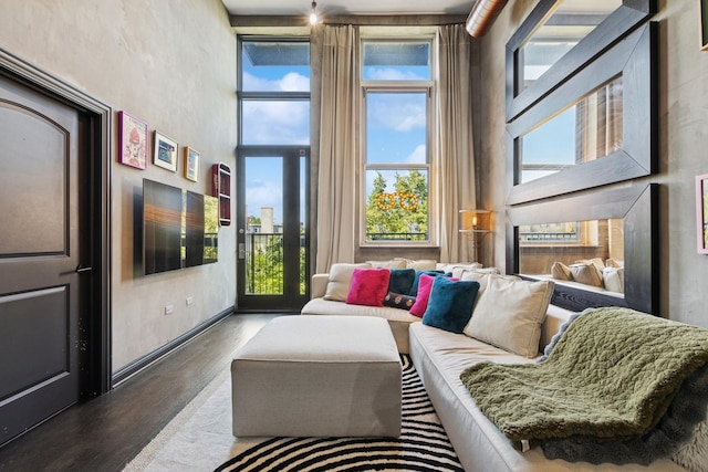 1215 W Gunnison St Unit 202, Chicago, IL 60640 - living area featuring healthy amount of natural light, wood finished floors, and a high ceiling