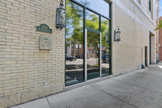 1215 W Gunnison St Unit 202, Chicago, IL 60640 - property entrance with brick siding