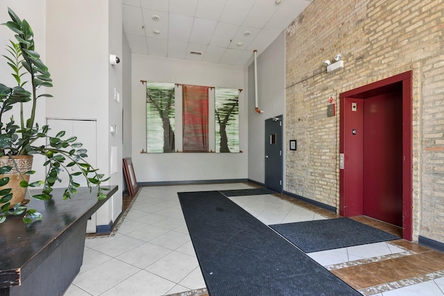 1215 W Gunnison St Unit 202, Chicago, IL 60640 - common area with a drop ceiling and a towering ceiling