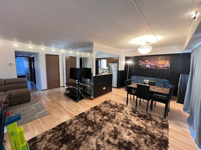 11111 Heritage Dr Unit 2A, Palos Hills, IL 60465 - dining room with light wood-style floors and a chandelier