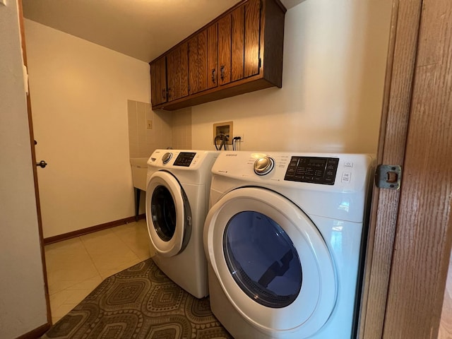 11111 Heritage Dr Unit 2A, Palos Hills, IL 60465 - washroom featuring cabinet space, washing machine and dryer, and light tile patterned floors
