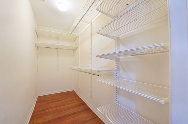 3002 W Montrose Ave Unit 2A, Chicago, IL 60618 - walk in closet featuring wood finished floors
