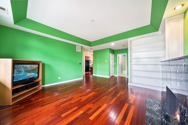 3002 W Montrose Ave Unit 2A, Chicago, IL 60618 - unfurnished living room featuring wood finished floors, a raised ceiling, a fireplace, and recessed lighting