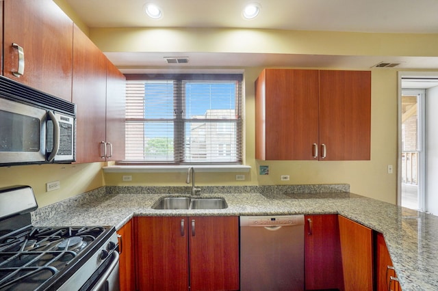 3002 W Montrose Ave Unit 2A, Chicago, IL 60618 - kitchen with appliances with stainless steel finishes, recessed lighting, and light stone countertops