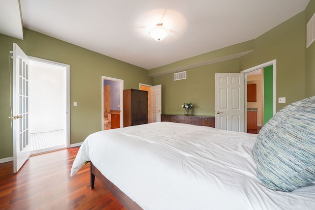 3002 W Montrose Ave Unit 2A, Chicago, IL 60618 - bedroom with wood finished floors and ensuite bathroom
