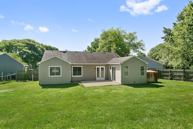 895 Fieldside Ln, Aurora, IL 60504 - back of property with a patio area, a fenced backyard, french doors, and a shingled roof