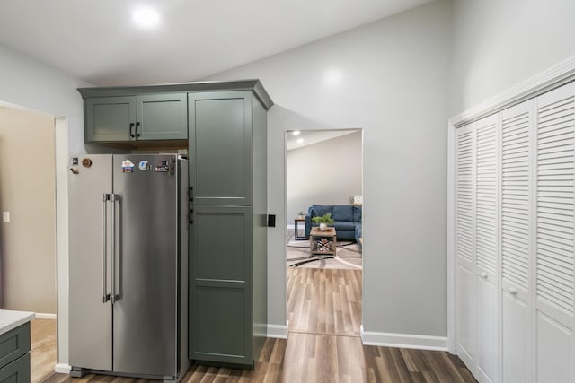 895 Fieldside Ln, Aurora, IL 60504 - kitchen with high end fridge, green cabinetry, dark wood-type flooring, and light countertops