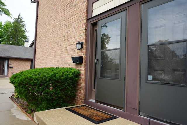 8234 Portsmouth Dr Unit D, Darien, IL 60561 - view of exterior entry with brick siding