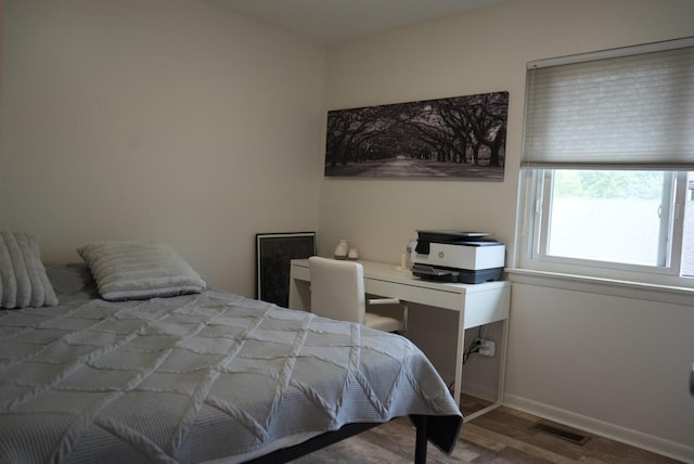 8234 Portsmouth Dr Unit D, Darien, IL 60561 - bedroom featuring wood finished floors and baseboards