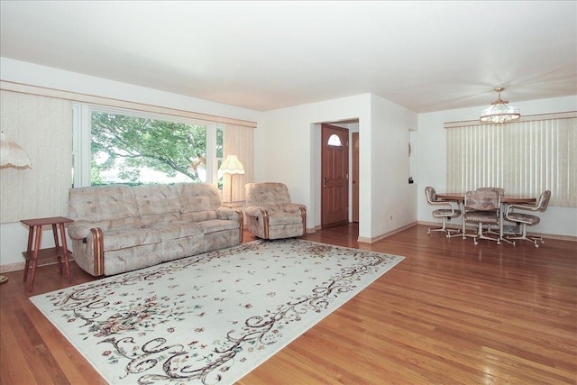 117 N Kenilworth Ave, Mount Prospect, IL 60056 - living room with wood finished floors and a chandelier