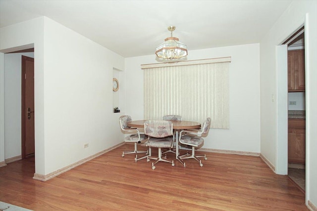 117 N Kenilworth Ave, Mount Prospect, IL 60056 - dining room with light wood finished floors and a chandelier