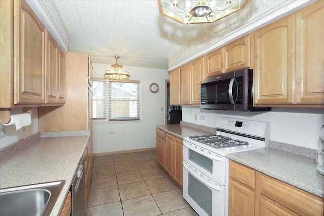117 N Kenilworth Ave, Mount Prospect, IL 60056 - kitchen featuring appliances with stainless steel finishes, a chandelier, light tile patterned floors, and light countertops