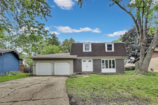 418 Surrey Ln, Lindenhurst, IL 60046 - view of front of home with an attached garage, a front lawn, driveway, brick siding, and mansard roof