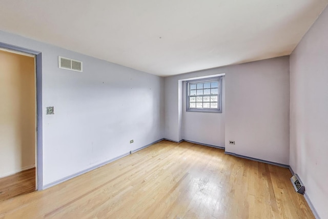 418 Surrey Ln, Lindenhurst, IL 60046 - empty room with plenty of natural light and light wood-type flooring