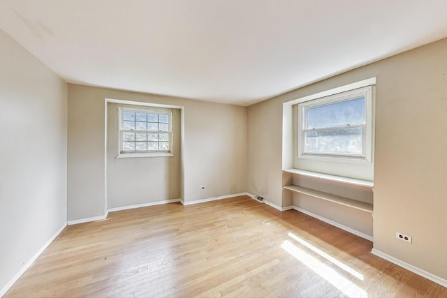 418 Surrey Ln, Lindenhurst, IL 60046 - empty room with light wood finished floors and baseboards