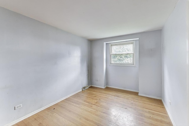 418 Surrey Ln, Lindenhurst, IL 60046 - unfurnished room featuring light wood finished floors and baseboards