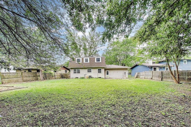 418 Surrey Ln, Lindenhurst, IL 60046 - back of property with a fenced backyard and a shingled roof