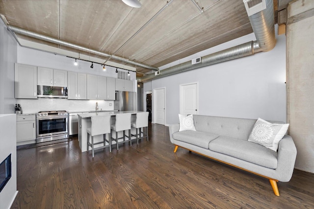 811 W 15th Pl Unit 709, Chicago, IL 60608 - living area with dark wood finished floors and rail lighting