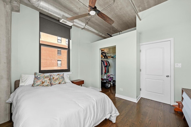 811 W 15th Pl Unit 709, Chicago, IL 60608 - bedroom featuring wood finished floors, a walk in closet, a closet, and a ceiling fan