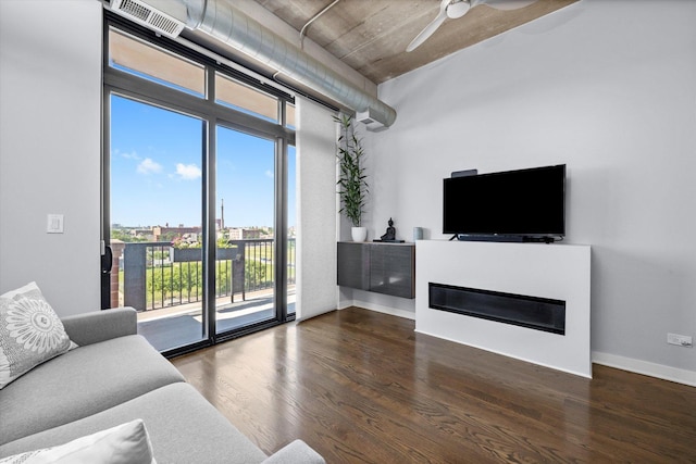 811 W 15th Pl Unit 709, Chicago, IL 60608 - living room featuring wood finished floors, a ceiling fan, and a glass covered fireplace