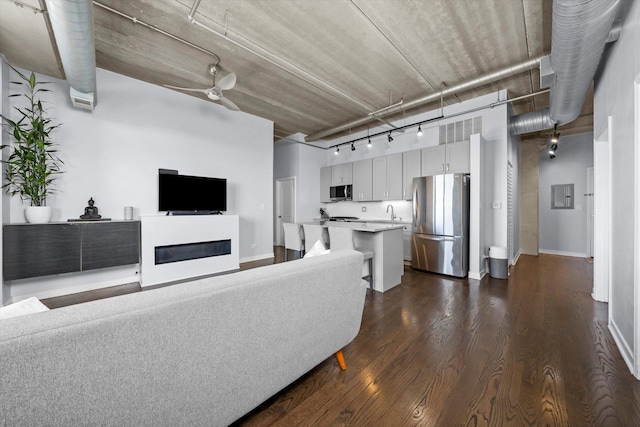 811 W 15th Pl Unit 709, Chicago, IL 60608 - living area with rail lighting, dark wood-style flooring, electric panel, and a glass covered fireplace