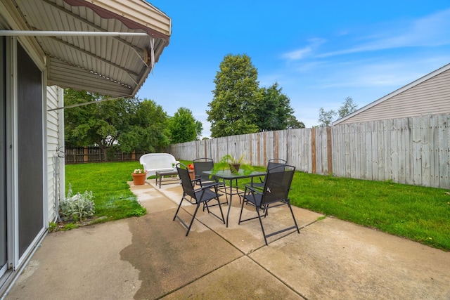 750 Shady Ln, Aurora, IL 60506 - fenced backyard featuring a patio and outdoor dining area