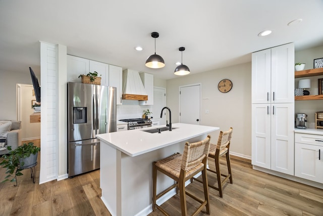 750 Shady Ln, Aurora, IL 60506 - kitchen featuring stainless steel appliances, light wood finished floors, white cabinetry, backsplash, and recessed lighting