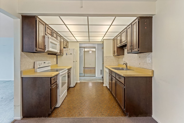 1717 W Crystal Ln Unit 310, Mount Prospect, IL 60056 - kitchen with white appliances, dark brown cabinets, light countertops, backsplash, and a paneled ceiling