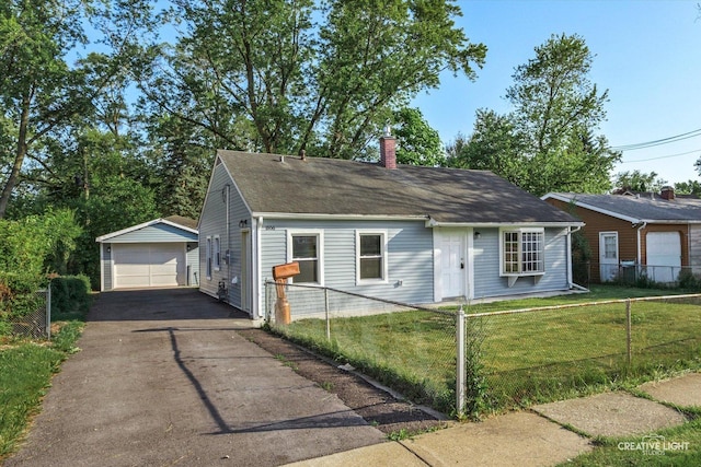 1806 E Sauk Trl, Sauk Village, IL 60411 - view of front of home with an outbuilding, a detached garage, a chimney, asphalt driveway, and roof with shingles