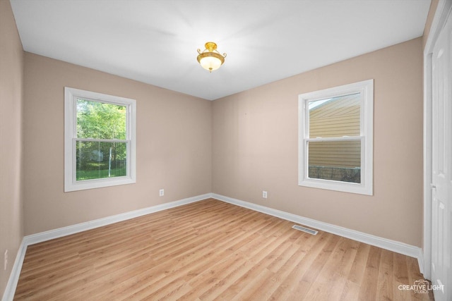 1806 E Sauk Trl, Sauk Village, IL 60411 - empty room with light wood-style flooring and baseboards