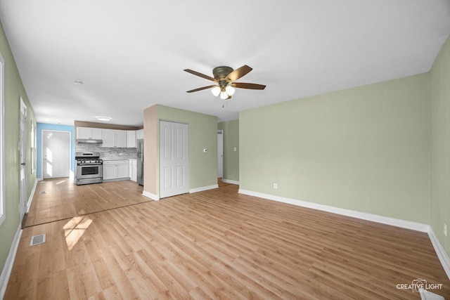 1806 E Sauk Trl, Sauk Village, IL 60411 - unfurnished living room with light wood finished floors and ceiling fan