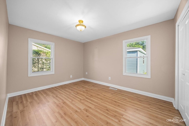 1806 E Sauk Trl, Sauk Village, IL 60411 - unfurnished room with baseboards and light wood-type flooring
