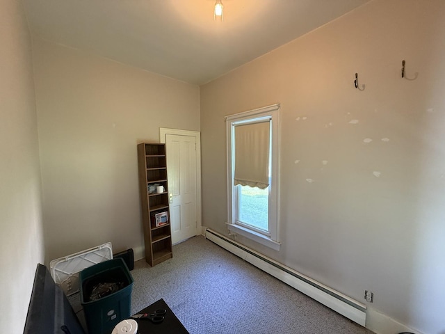 325 E Waupansie St, Dwight, IL 60420 - unfurnished room with baseboard heating and light carpet