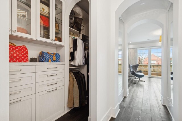 1414 N Mohawk St, Chicago, IL 60610 - hall featuring crown molding, arched walkways, and dark wood-style flooring