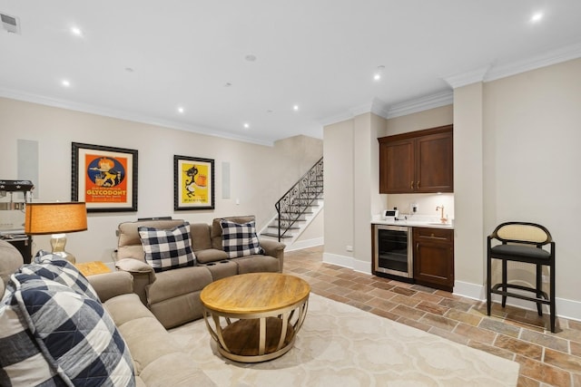 1414 N Mohawk St, Chicago, IL 60610 - living area with wine cooler, wet bar, crown molding, recessed lighting, and stone tile flooring