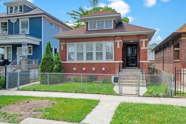 11402 S Calumet Ave, Chicago, IL 60628 - view of front of house featuring a gate, brick siding, a porch, a fenced front yard, and roof with shingles