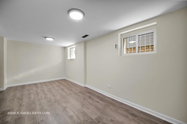 11402 S Calumet Ave, Chicago, IL 60628 - basement with wood finished floors and baseboards
