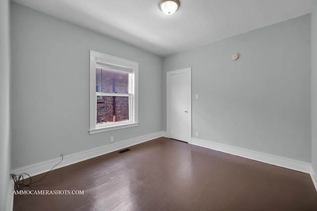 11402 S Calumet Ave, Chicago, IL 60628 - spare room with wood finished floors and baseboards