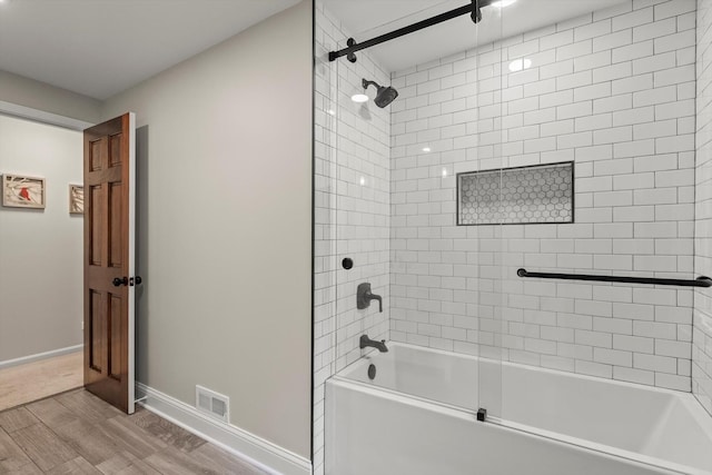 124 Hidden Oaks Dr, Barrington, IL 60010 - bathroom featuring washtub / shower combination and wood finished floors